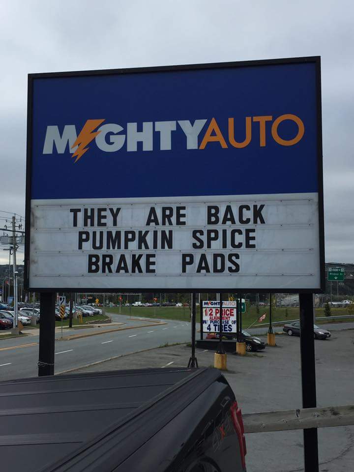 Funny picture of a sign outside Mighty Auto joking that they have Pumpkin spice brake pads in stock