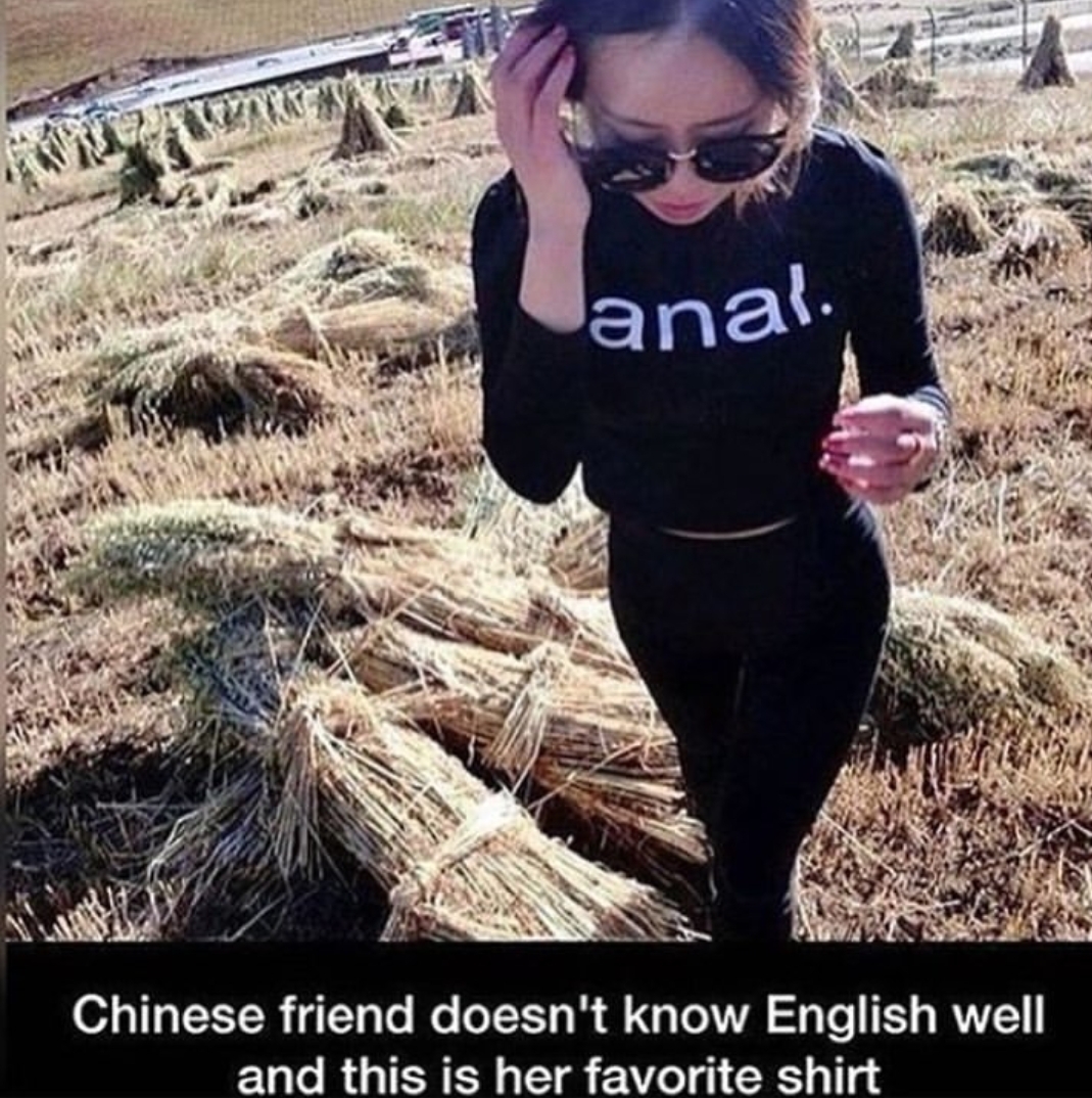 Chinese girl wearing shirt that she doesn't understand what it means
