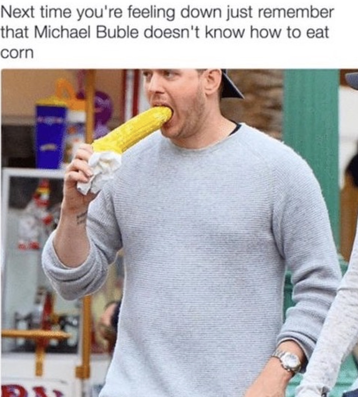 funny meme of Michael Buble eating corn on the cob wrongly