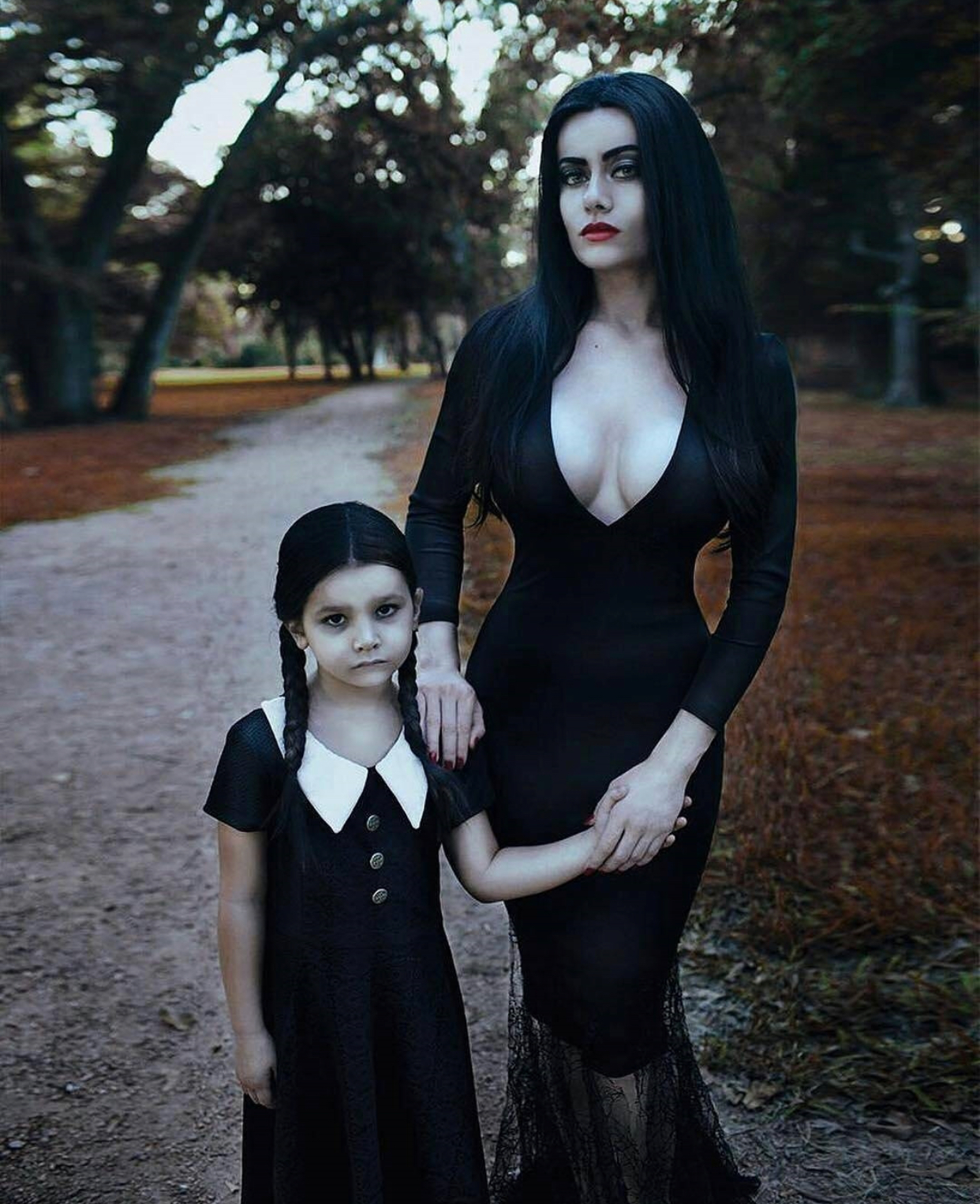 Mother and Daughter dressed like Adams Family for Halloween