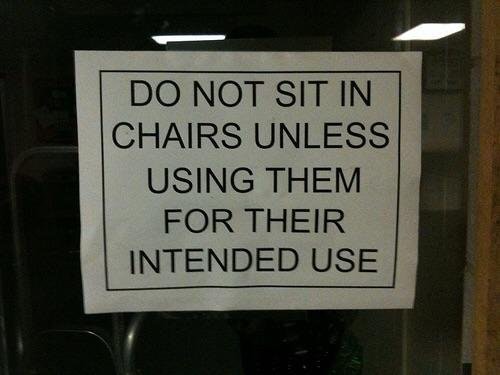 stupid signs - Do Not Sit In Chairs Unless Using Them For Their Intended Use