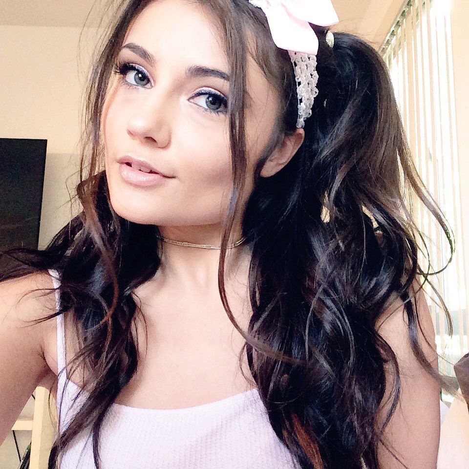 Adria Rae wearing a pink shirt and a bow in her hair - Hottest Pornstars of 2018