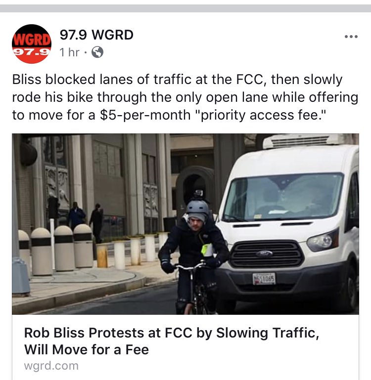 van - Wgrd 97.9 Wgrd 97.91 hr. Bliss blocked lanes of traffic at the Fcc, then slowly rode his bike through the only open lane while offering to move for a $5permonth "priority access fee." 31085 Rob Bliss Protests at Fcc by Slowing Traffic, Will Move for