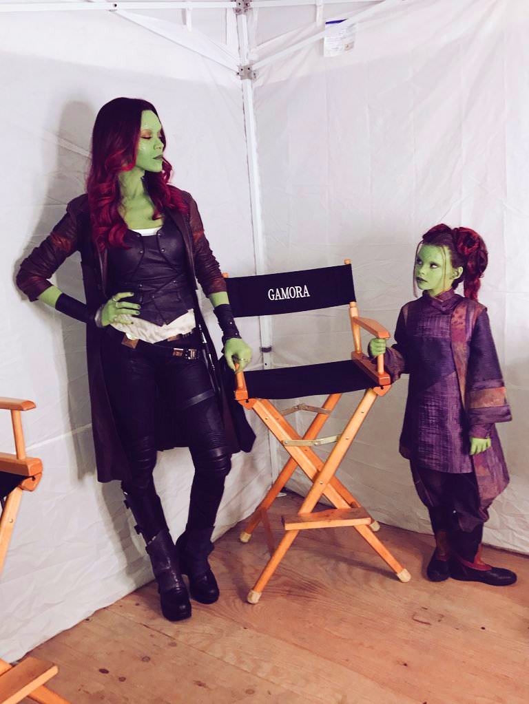 pic of adult Gamora and child Gamora fighting for a chair