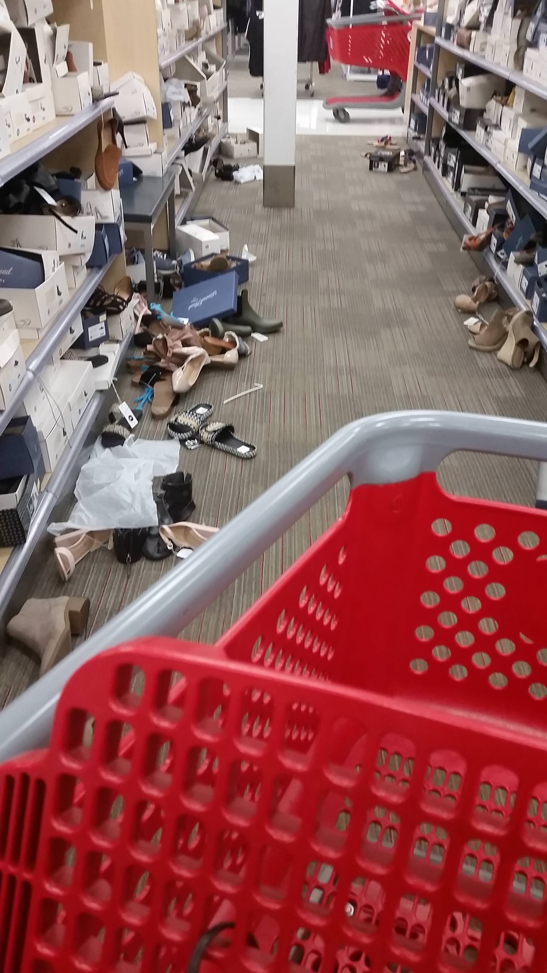 infuriating picture of a shoe store that has been left an absolute mess by customers