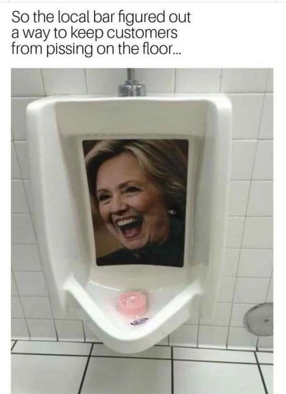 hillary in urinal - So the local bar figured out a way to keep customers from pissing on the floor...