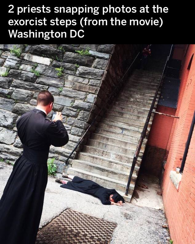 funny picture of 2 priests snapping photos at the exorcist steps from the movie in Washington DC
