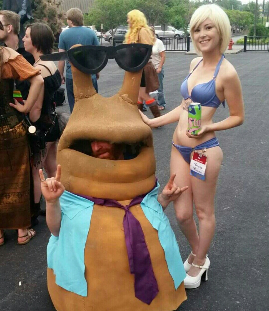 man in funny costume and girl in bikini