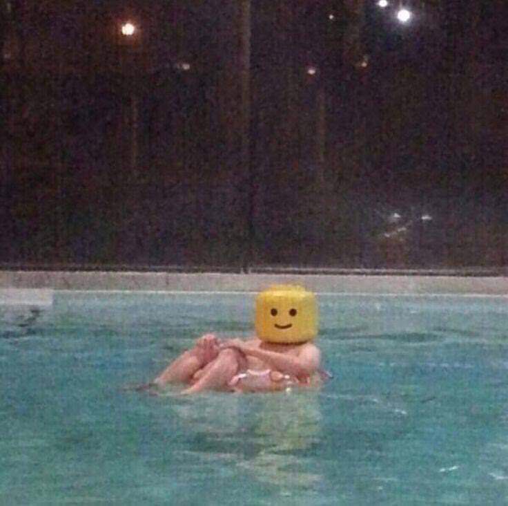 lego man floating in the pool