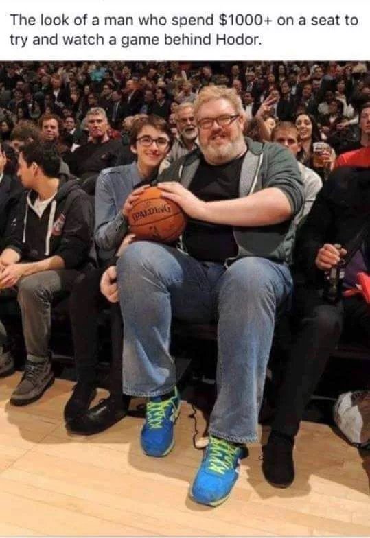 hodor from game of thrones - The look of a man who spend $1000 on a seat to try and watch a game behind Hodor.