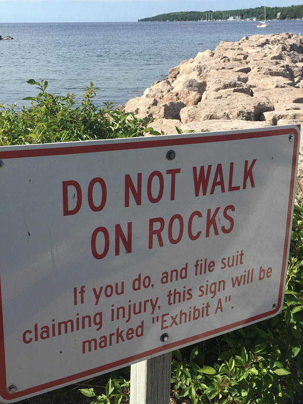 sign will be exhibit - Do Not Walk On Rocks If you do, and file suit claiming injury, this sign will be marked "Exhibit A".