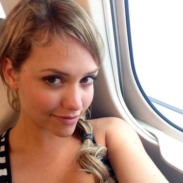 Mia Malkova taking a selfie on a plane.