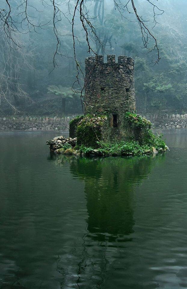 castle in the middle of a lake