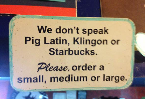 street sign - We don't speak Pig Latin, Klingon or Starbucks. Please, order a small, medium or large.