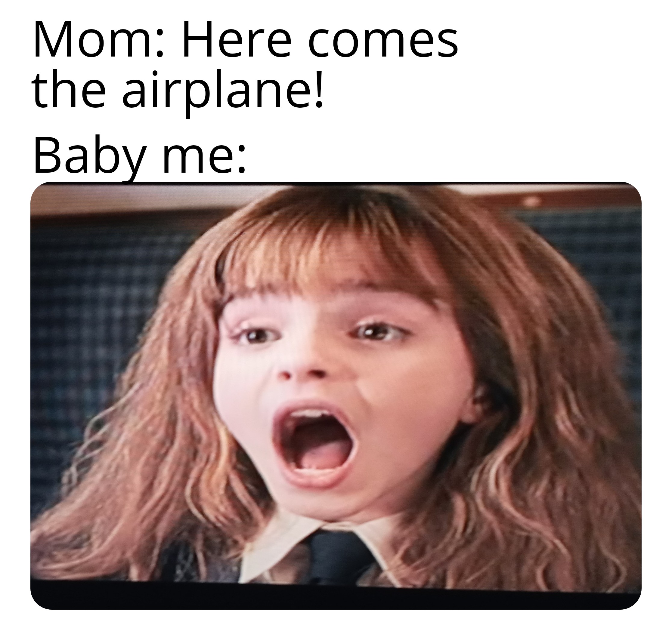 photo caption - Mom Here comes the airplane! Baby me