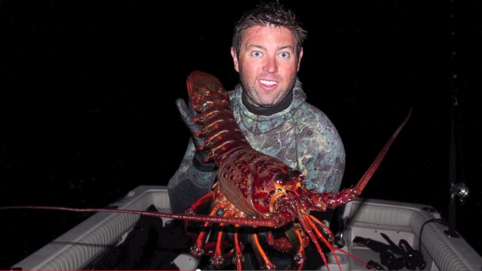 Forrest Galante poses with a nearly 12-pound 5.4 kg lobster he caught off the coast of California