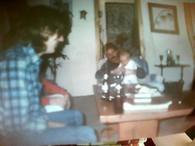 Here's a photo of me sitting on my dads lap.  On the back of the picture it says  "6 months",   'Gimmie more beer dad!'     