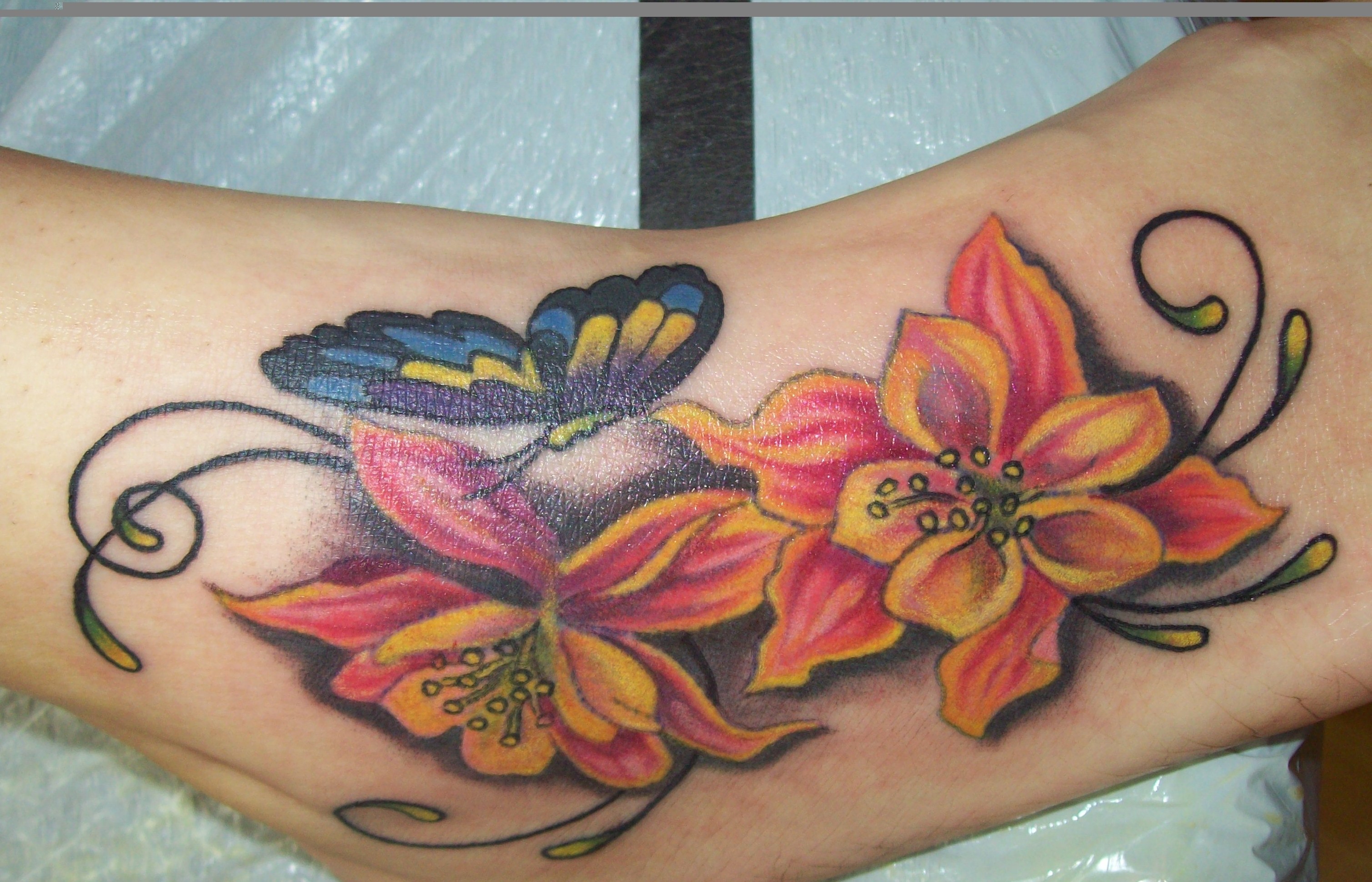 Tattoo i did in the past month, floweres on foot. no outline