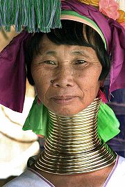 The Padaung tribe in Burma use neck rings to push down their shoulders,to make them appear longer.