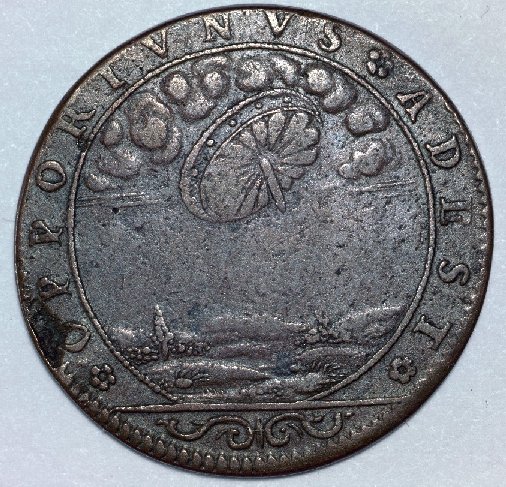 This is a French jeton minted in 1680, a coin-like educational tool that was commonly used to help people count money, or sometimes used as a money substitute for playing games. It is about the size of a U.S. quarter-dollar and similar to thousands of other jetons with different religious and educational designs that were produced and used in Europe during the 16th and 17th centuries. It appears to commemorate a UFO sighting of a wheel like object. Some researchers feel it represents the Biblical Ezekiel's wheel. The Latin inscription 'OPPORTUNUS ADEST' translates as 'It is here at an opportune time'.