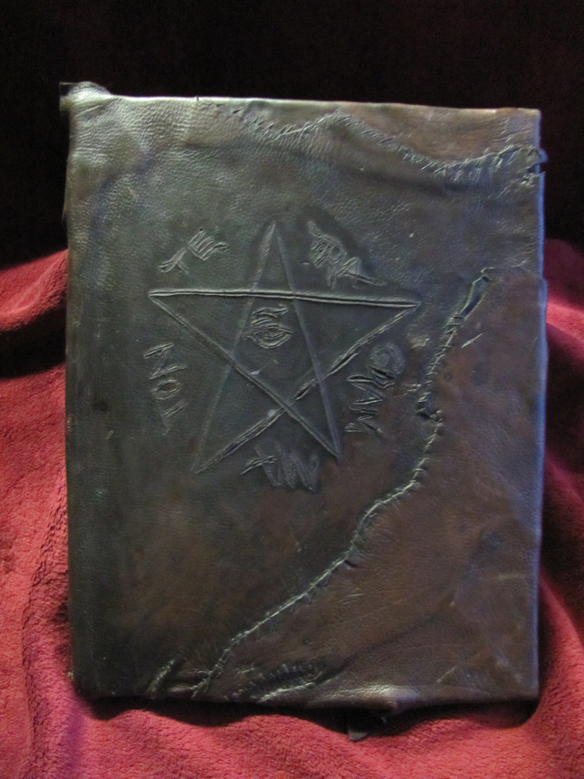 Genuine Book of Shadows, 1800-1815. Deerskin and catgut with gun powder branding, and written in bird's blood.