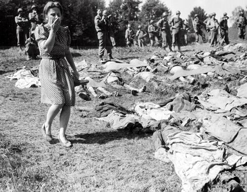 A German girl is horrified at hundreds of dead following US Army's liberation at Namering, Germany. Soldiers would force townspeople outside camps to travel through bodies of the murdered so any who feverishly denied the holocaust could personally view the work of Nazi leaders.