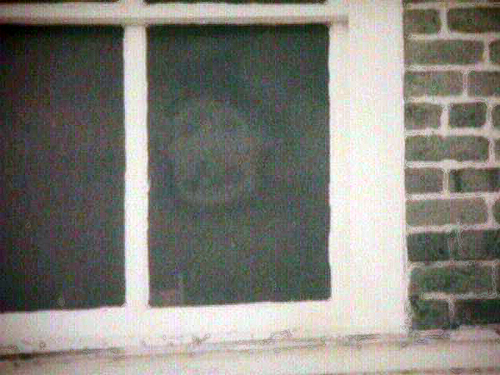 "The Face in the Window" at the Pickens County Courthouse in Carrollton, Alabama.