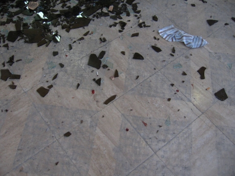 Broken glass and shell casings.