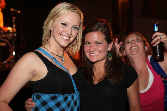 Some chick bombing a photo op at a bar.