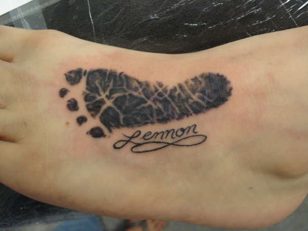 A tattoo on a foot of a foot