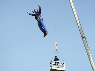 The highest height a human was catapulted using a reverse bungee system is 54.25 m