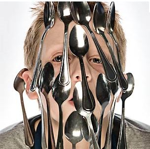 The most spoons balanced on the face is 17 and was achieved by Aaron Caissie Canada
