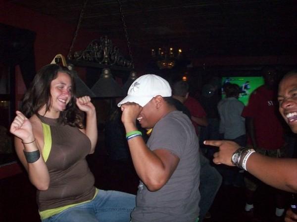 Check out the muffin top on this girl and what looks like her loser boyfriend/friend or whatever trying to dance like an idiot!!!
