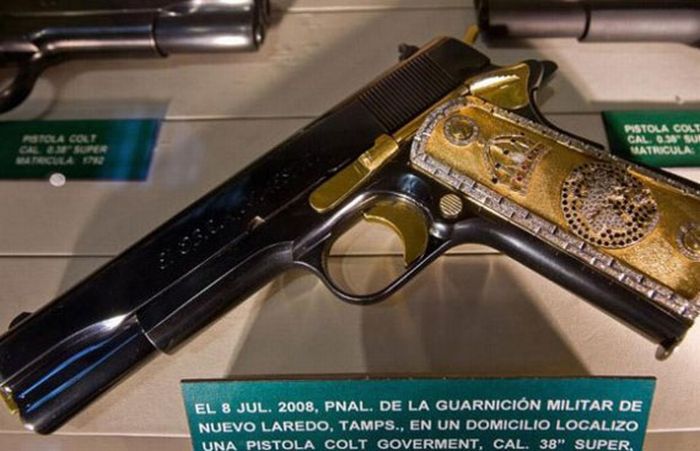 Gold and Titanium 45 Caliber semi automatic pistols - they found 16 like this
