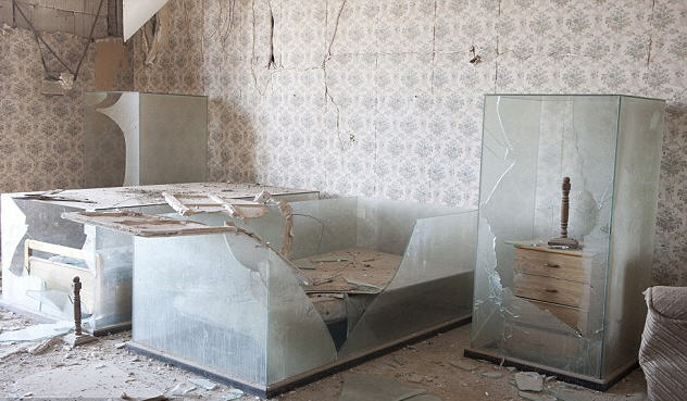 These glass cases protected the bed of Gaddafi's adopted daughter Hana, whose bedroom was a shrine following her death during a 1986 U.S. air strike 