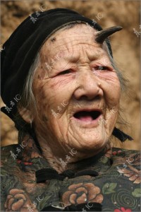 Old Chinese Women With A Horn