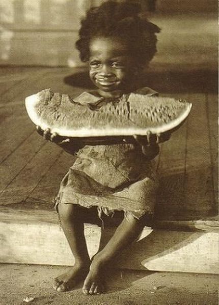 random pic black kid eating watermelon