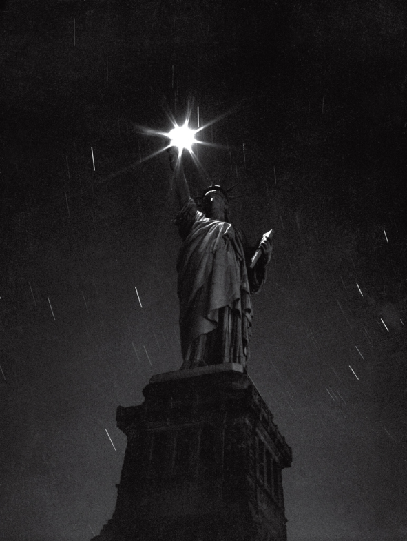 The Statue of Liberty photographed during a power failure in 1942.