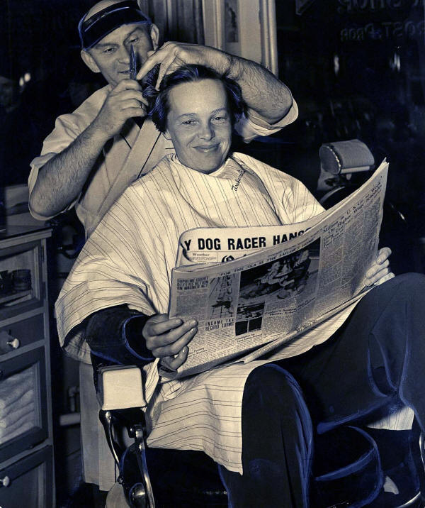 Amelia Earhart receives what proved to be her last haircut in 1937.