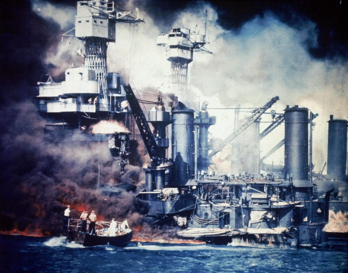 A rescue boat comes alongside the crippled USS West Virginia shortly after the Japanese attack on Pearl Harbor in 1941.