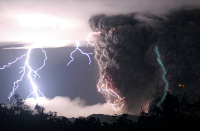 This picture shows a green lightning bolt that was spotted near a volcanic eruption in Chile look to the right. The green coloration is created by excited oxygen atoms.