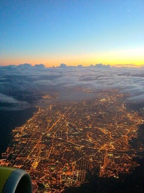 Night on Earth, day in the sky. Barcelona.
