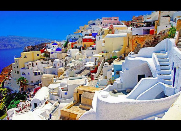 Santorini, Greece - also known as Thera, is a volcanic island in the Aegean Sea. These colorful buildings and beautiful ocean views attract tourists from around the world.