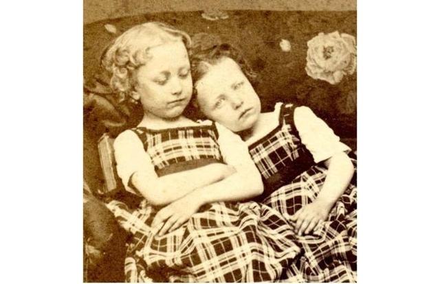 Subjects could be posed as though they were asleep. The little girl on the right may have been sitting for this portrait for hours with her dead sister.