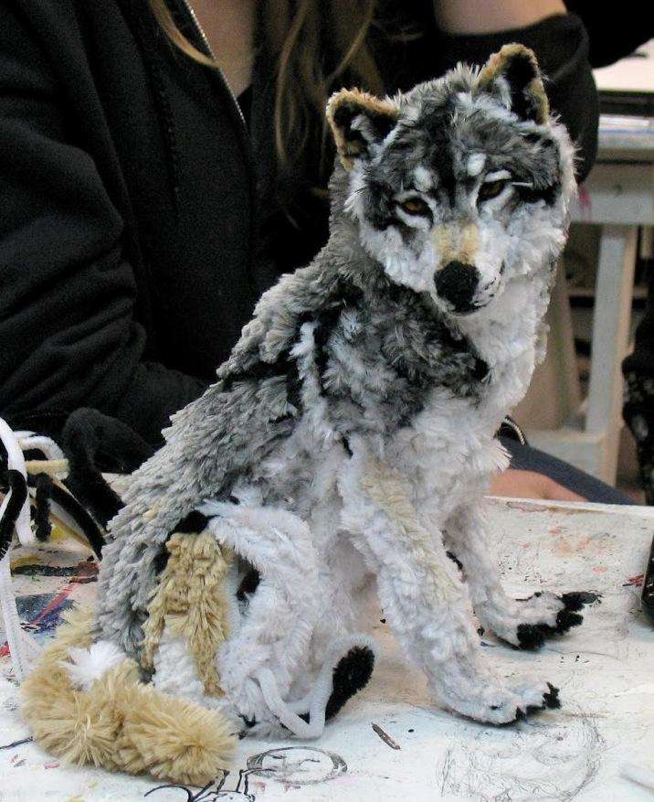 A wolf sculpture made out of pipe cleaners