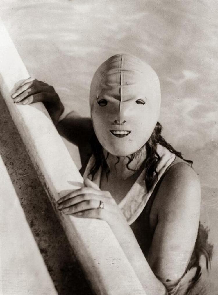 A mildly scary swimming mask designed for protecting the entire mouth of women from the sun. (1920)