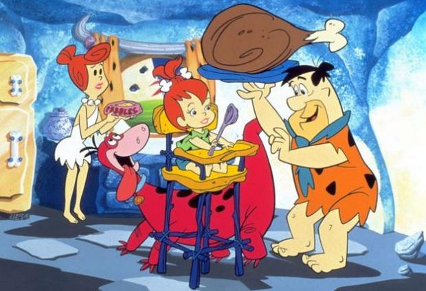 THE FLINTSTONES TAKES PLACE IN A POST-APOCALYPTIC FUTURE - This fan theory posits that the worlds inhabited by the Jetsons and the Flintstones exist concurrently. The Flintstones' civilization was "bombed back to the Stone Age" during a nuclear war, and its inhabitants were forced to start over. That's why the Flintstones use the materials (and animals) at their disposal to mimic modern technology (like when they use birds' beaks to play records). Why would cavemen from the prehistoric past need garbage disposals and record players, if not to replicate how their society once was? 

The Jetsons, for their part, live in Orbit City, a metropolis built entirely above the clouds. Ever wonder what’s below Orbit City? Many people believe that the civilization depicted on The Flintstones is happening down on Earth. In addition, some fans suspect that the only thing dividing the Jetson and the Flintstone families is income. The Jetsons can afford to live in the fancy new society above the clouds, while the working class Flintstones are forced to make do in the ruins of Earth.     

When you consider the time period during which both shows were created, this premise doesn't seem all that far-fetched. After all, both shows were developed at the height of the Cold War, during a time when Americans constantly feared a nuclear attack by Communist Russia.