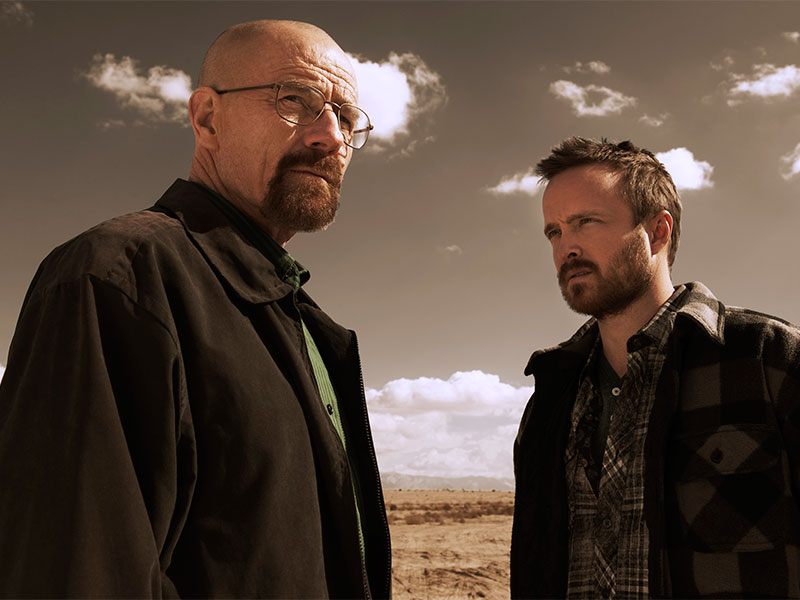 BREAKING BAD IS A PREQUEL TO THE WALKING DEAD - At the end of Breaking Bad, Walter White’s (Bryan Cranston) blue meth is becoming more and more popular across the country, eventually making its way around the world. Some fans think that users die, only to rise again in zombie form. Those who subscribe to this theory point to the handful of Breaking Bad references on The Walking Dead. 

In season one, Glenn (Stephen Yeun) drives a red Dodge Challenger, which looks very similar to Walter White’s car. And when Walter White goes to return his Dodge on Breaking Bad, he takes it back to the dealership’s general manager, whose name is also Glenn.

In season two, Daryl Dixon (Norman Reedus) is trying to bring down T-Dog’s (IronE Singleton) injury-induced fever, so he pulls out his brother Merle's stash of drugs to see if anything in the plastic bag will do the trick. Pictured clearly at the bottom of the bag: blue crystal meth. Even more suspicious: before the zombie apocalypse, Merle Dixon (Michael Rooker) used to be a drug dealer. His supplier was described as “a janky little white guy” who threatened Merle with a gun and said, "I'm gonna kill you, bitch!" Sounds like Jesse Pinkman (Aaron Paul) to me.