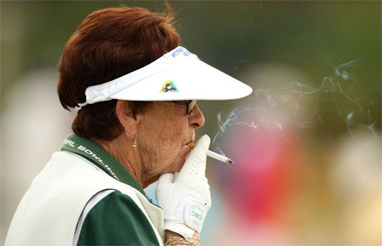 Some competitors didn’t appear to worry so much about being well-toned athletes. This woman smoked a cigarette while taking part in the bowling.