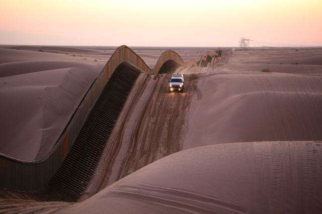 Algodones Sand Dunes Curvy Border Fence in Southern California